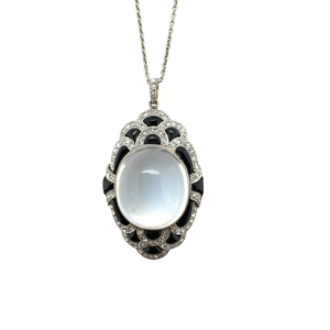 Edwardian Platinum over Gold Moonstone, Onyx, and Diamond Pendant